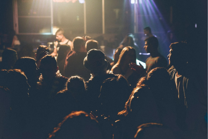 Live music crowd reflecting the culture and creativity that inspires Masc Femme clothing